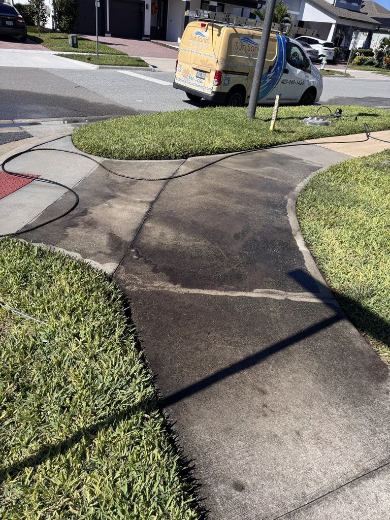 Pressure washing driveway and exterior surfaces