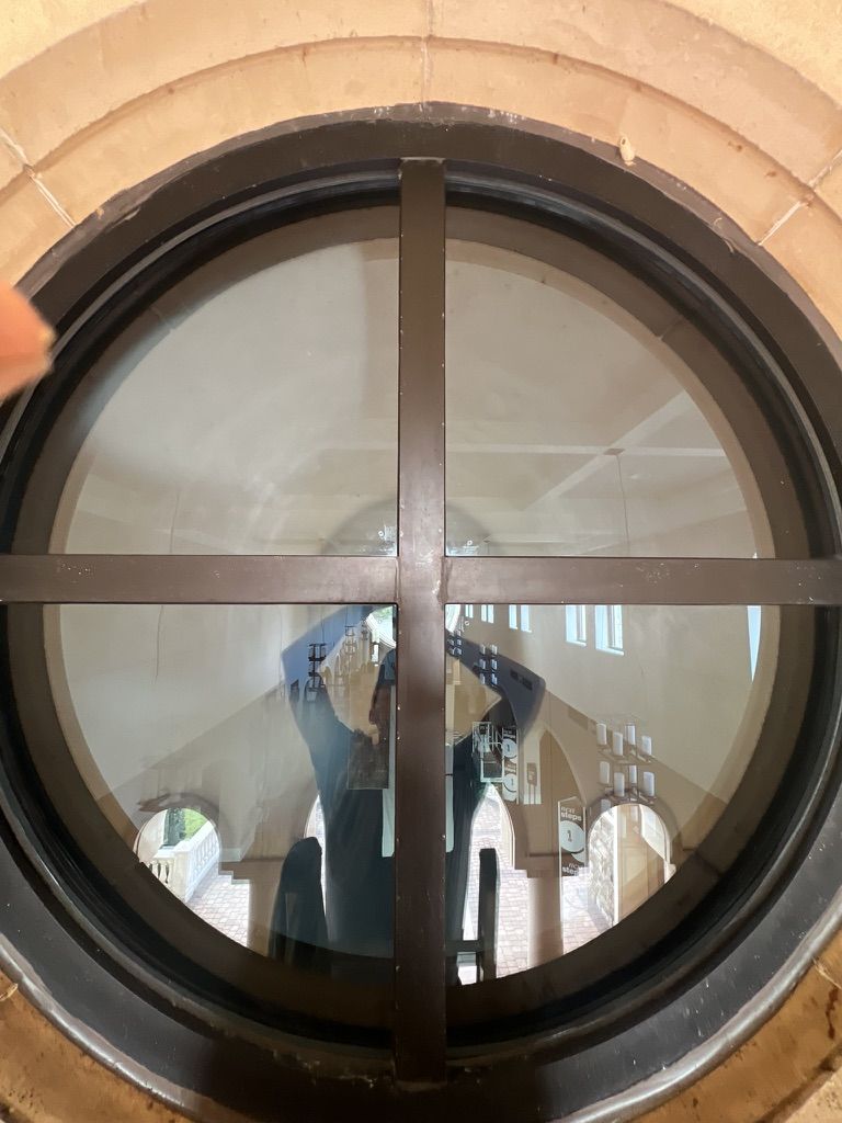 Sun Sands technician cleaning a window in Windermere, FL