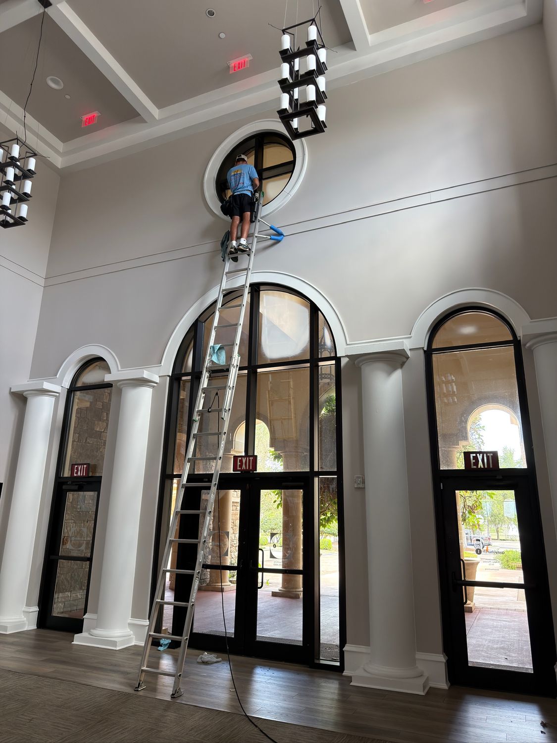 Sun Sands technician cleaning a window in Windermere, FL