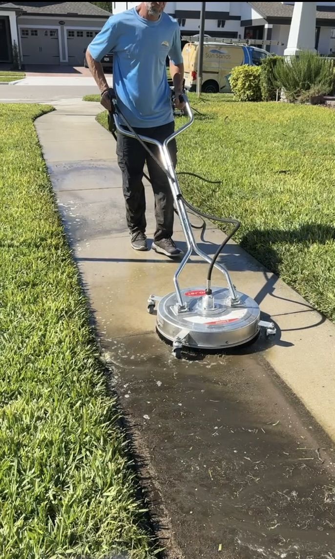 Pressure washing driveway and exterior surfaces